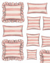 Set of pink and white striped pillows with ruffled edges on a white background