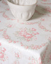 White ceramic bowl on a floral-patterned tablecloth