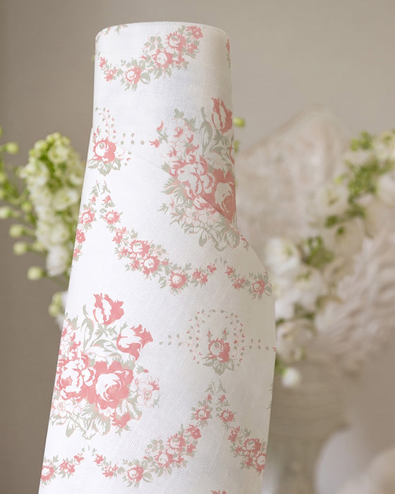 Roll of floral-patterned wallpaper with a decorative background