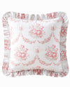 Floral patterned pillow with ruffled edges on a white background