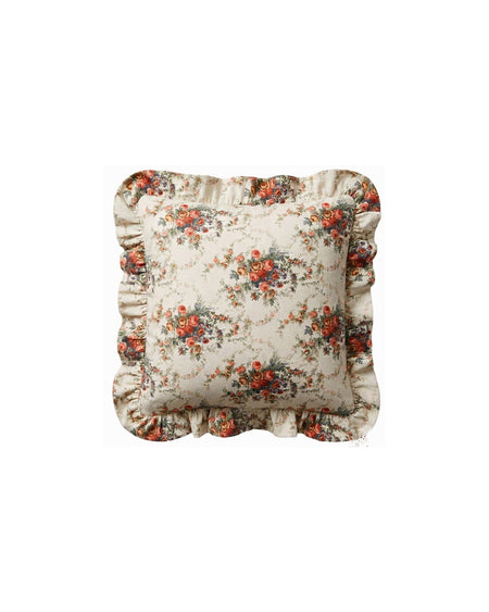 Floral patterned pillow with ruffled edges on a white background