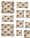 Set of floral patterned pillows with ruffled edges on a white background