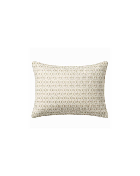 Decorative pillow with a subtle pattern on a white background