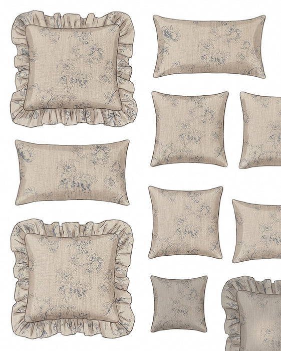 Set of decorative pillows with floral patterns and ruffled edges on a neutral background.