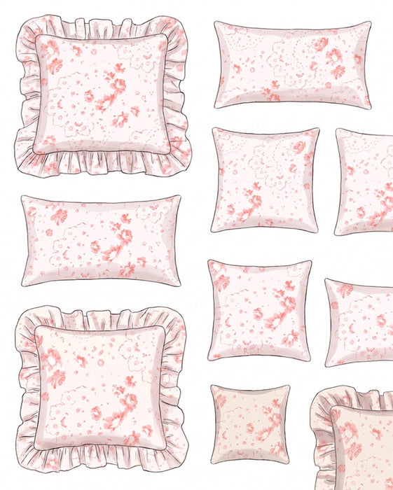 Set of decorative pillows with floral pattern and ruffled edges on a white background