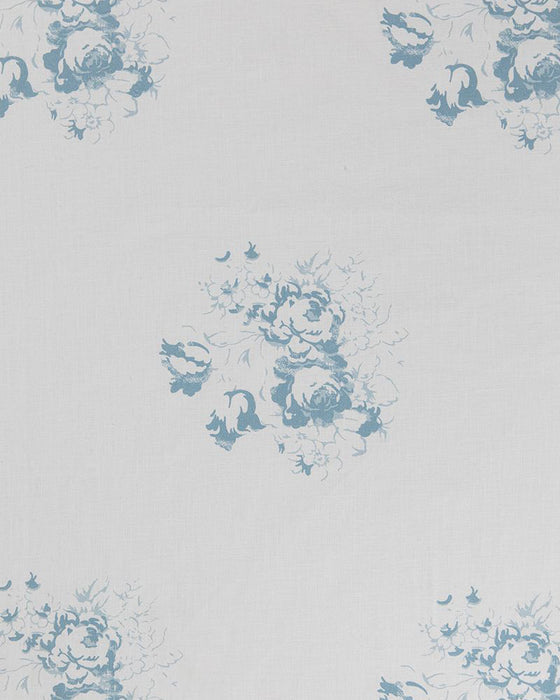 A patterned fabric with blue floral motifs on a white background.