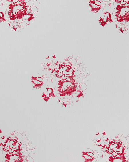White linen fabric with a red floral bouquet motif printed across it.